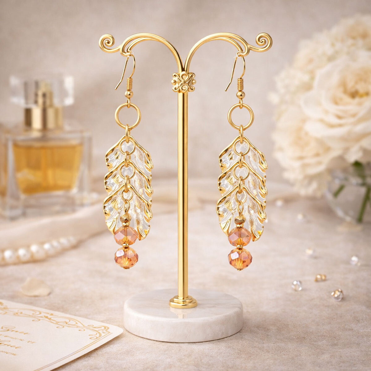 Długie kolczyki płatki przezroczyste złote brzegi kryształki Lume Design