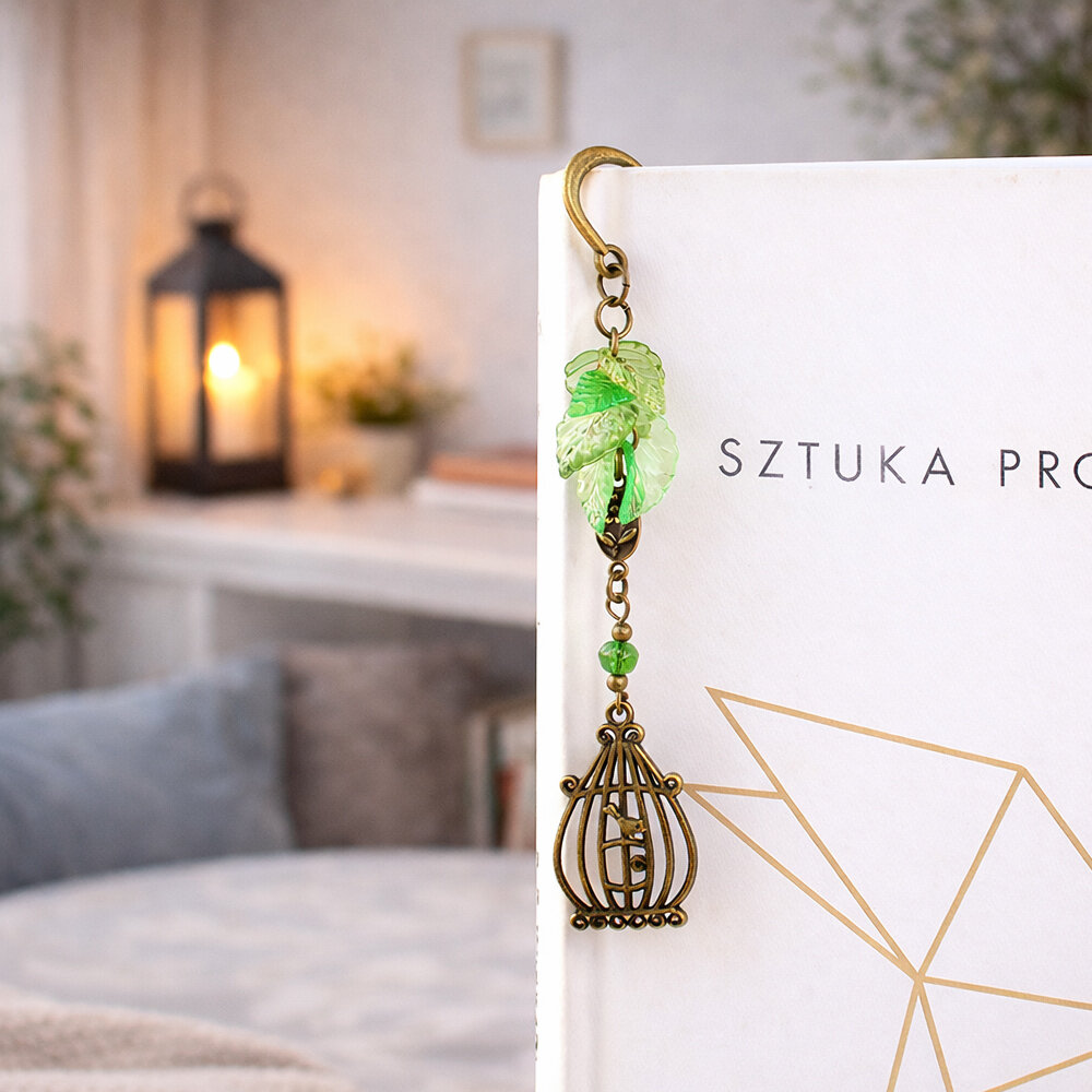 Zakładka do książki z antycznego brązu z zawieszką w kształcie ptaszka w klatce, akrylowymi listkami i szklanym koralikiem