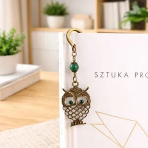 Zakładka do książki z antycznego brązu w kształcie pióra z zawieszką przedstawiającą uroczo wyrzeźbioną sowę i akrylowy listek.