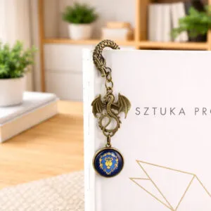 Zakładka do książki z antycznego brązu z motywem smoka i zawieszką z logiem Przymierza (Alliance) z gry World of Warcraft pod kaboszonem.